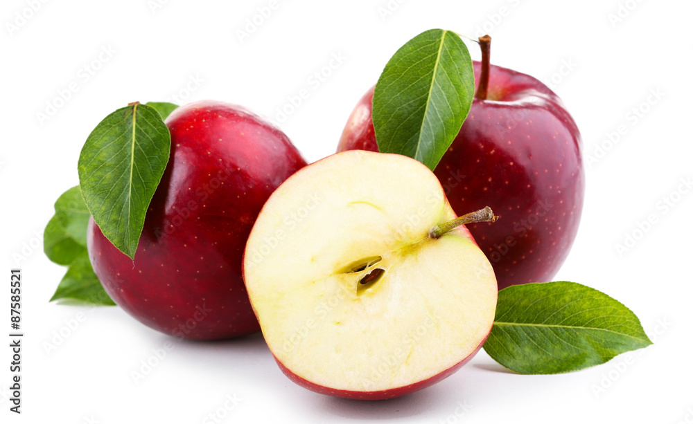 Red apples with leaves and slice isolated on white