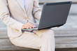 © Syda Productions - close up of business woman with laptop in city