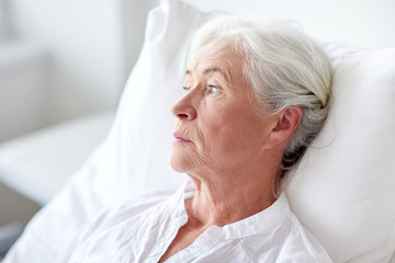 Sticker - senior woman patient lying in bed at hospital ward