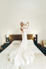 Wall Mural - beautiful gorgeous stylish bride with orchids  in the morning in the room