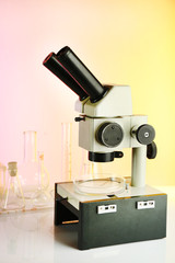 Wall Mural - test tubes and microscope on bright background
