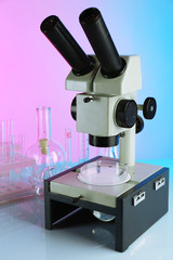 Wall Mural - test tubes and microscope on bright background