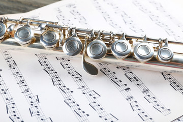 Wall Mural - Silver flute on music notes background