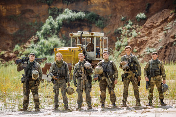 Wall Mural - rangers  team standing with rifle and looking at camera