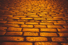 orange cobblestone road  with sunlight in evening