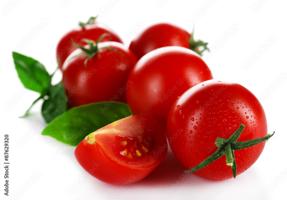 Cherry tomatoes with basil isolated on white