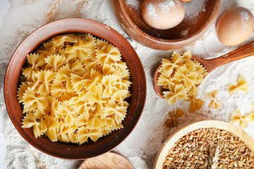 Poster - Preparing pasta with white flour and wheat on table, closeup