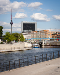 Wall Mural - The River Spree, Berlin, with the iconic landmark Alexanderplatz television tower visible.