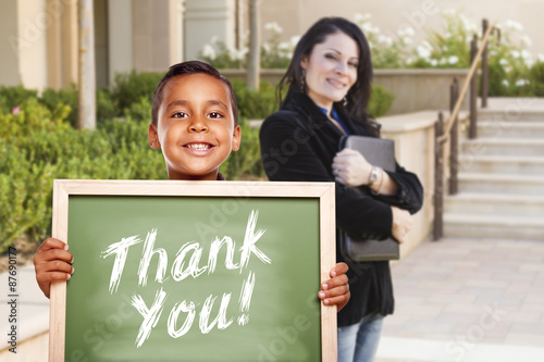 Boy Holding Thank You Chalk Board with Teacher Behind