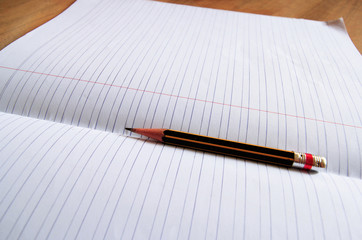 pencil lying on a blank paper