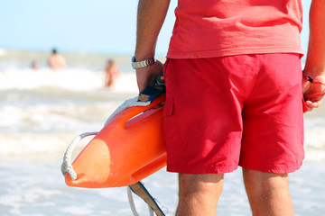 lifeguard with the rescue can to rescue the swimmers in case of