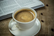 © DN6 - Close up glasses on newspaper and Coffee on the wooden table in