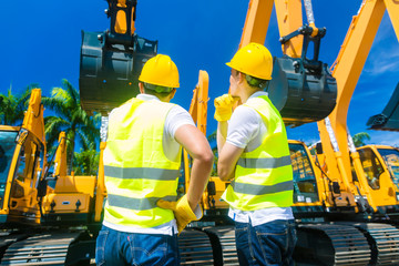 Asian workers on construction site