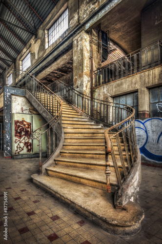 Obraz w ramie Imposing staircase inside the hall of an abandoned power plant