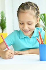 Wall Mural - Little girl drawing at home