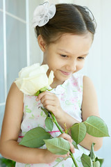 Poster - Little girl with  rose flower.