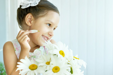 Wall Mural - little girl with dasies flowers