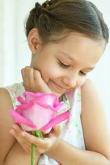 Wall Mural - little girl with rose flower
