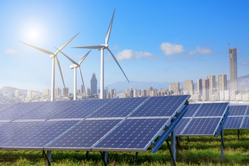 Solar panels and wind turbines with city