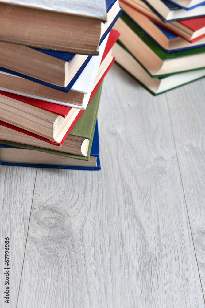 Stacks of books on wooden background