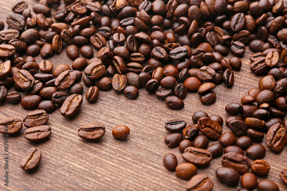 Coffee beans on wooden background