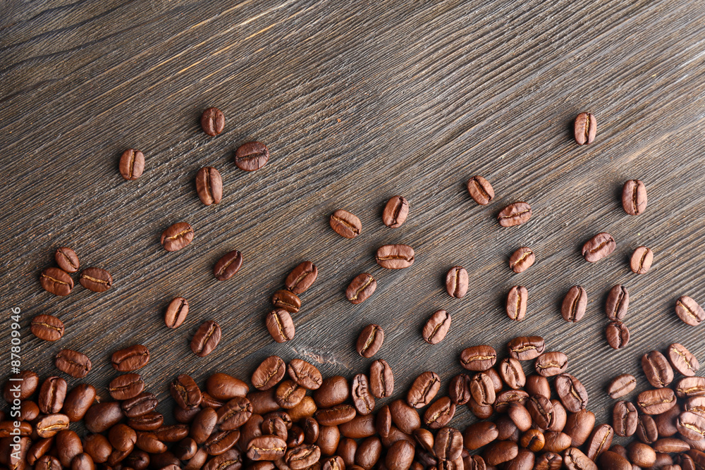 Coffee beans on wooden background