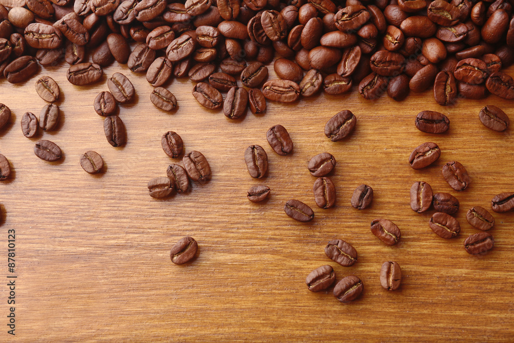 Coffee beans on wooden background