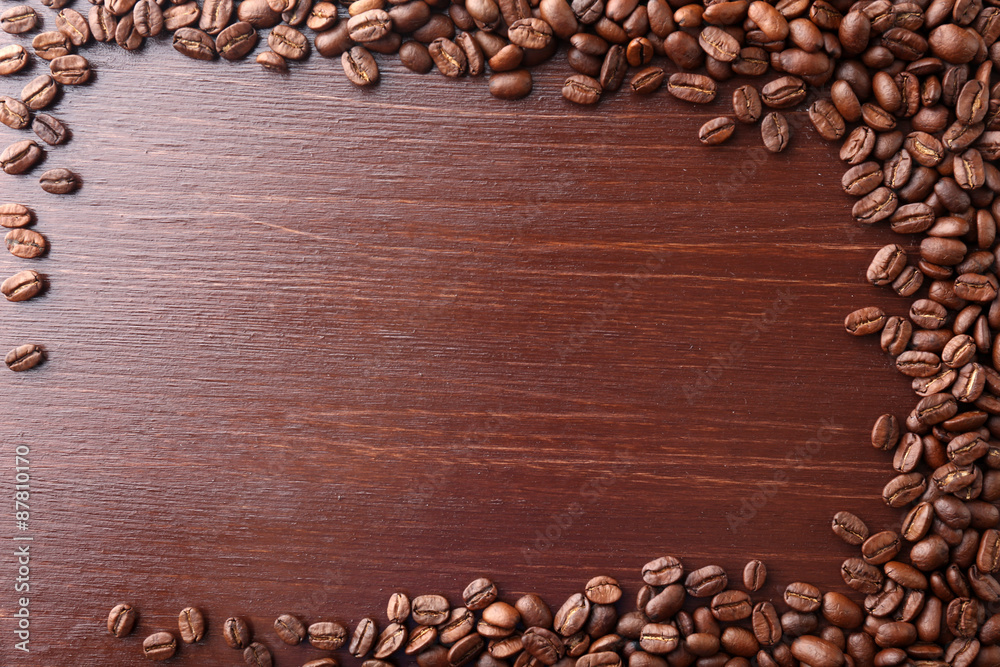 Coffee beans on wooden background