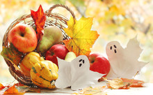 Fruits And Pumpkins In Basket With Autumn Leaves