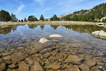 Clear Water Of The Glacial Lake In The Madriu-Perafita-Claror Valley