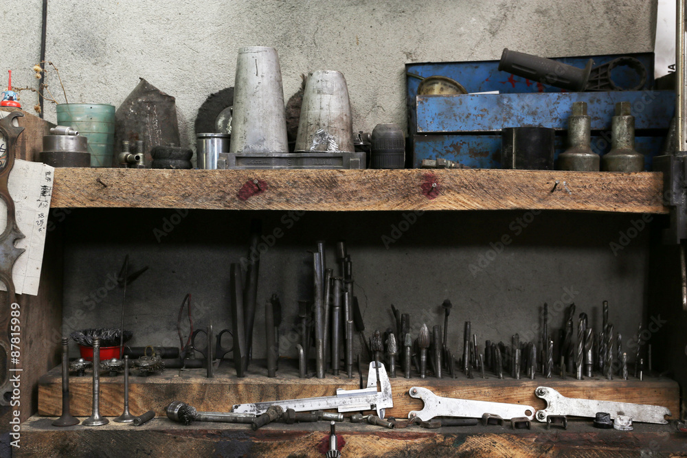 Different tools on workplace in garage