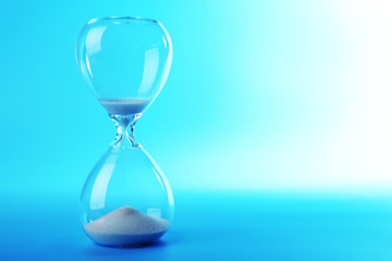 Hourglass on blue background