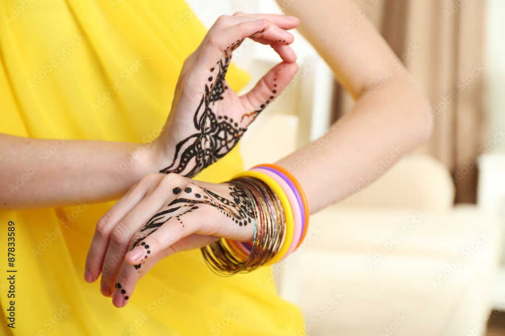 Image of henna on female hands, closeup