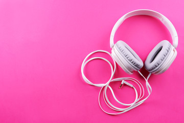 Wall Mural - Headphones on pink background