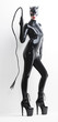 © Richard Semik - standing woman wearing latex clothes with a whip