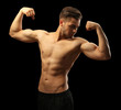 © Africa Studio - Muscle young man on dark background