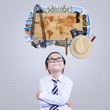 © Creativa Images - Little boy imagine famous vacation place