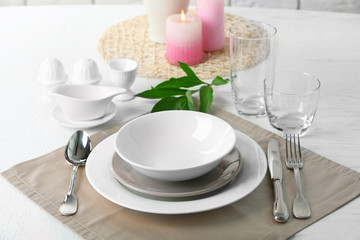 Beautiful table setting with candles close up