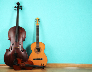 Poster - Musical instruments on turquoise wallpaper background