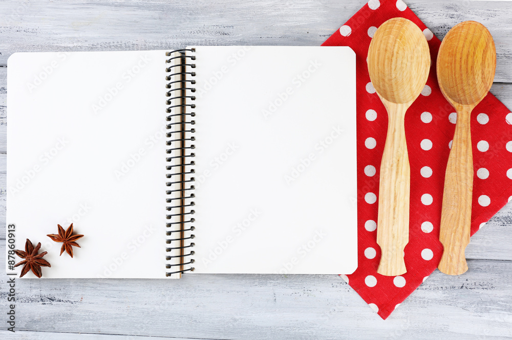 Open recipe book on wooden background