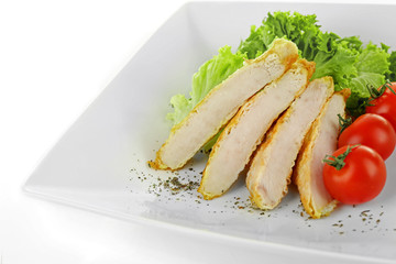 Sticker - Slices of  chicken fillet with cherry tomato and lettuce on plate isolated on white