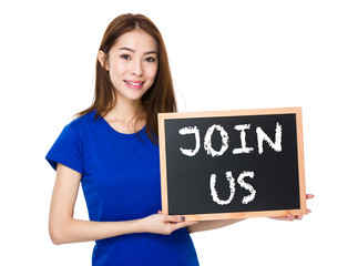 Student hold with wooden chalkboard showing join us on board