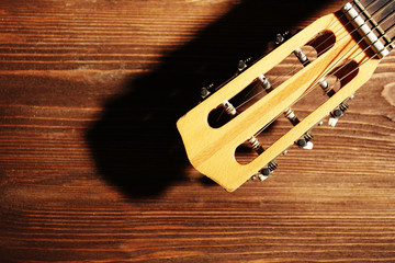 Poster - Acoustic guitar on wooden background