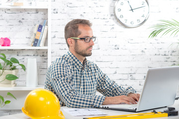 young engineer working on his laptop