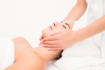 Wall Mural - Attractive woman receiving facial massage at spa center