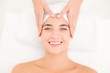 © WavebreakMediaMicro - Attractive young woman receiving facial massage at spa center