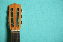 Classical Guitar On Turquoise Wallpaper Background