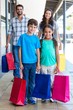 © WavebreakmediaMicro - Happy family having fun in the mall