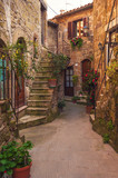 Fototapeta Uliczki - Italian old ancient alley in the medieval Tuscan town