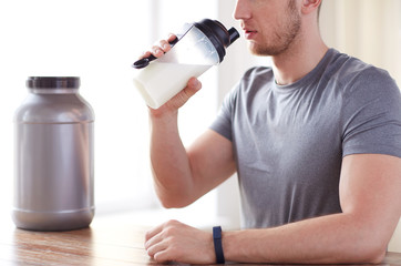 Wall Mural - close up of man drinking protein shake